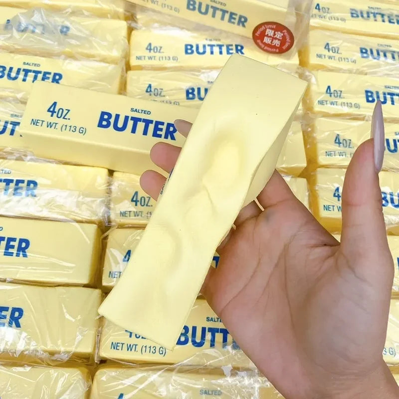 Butter stick fidget squashed flat in a hand