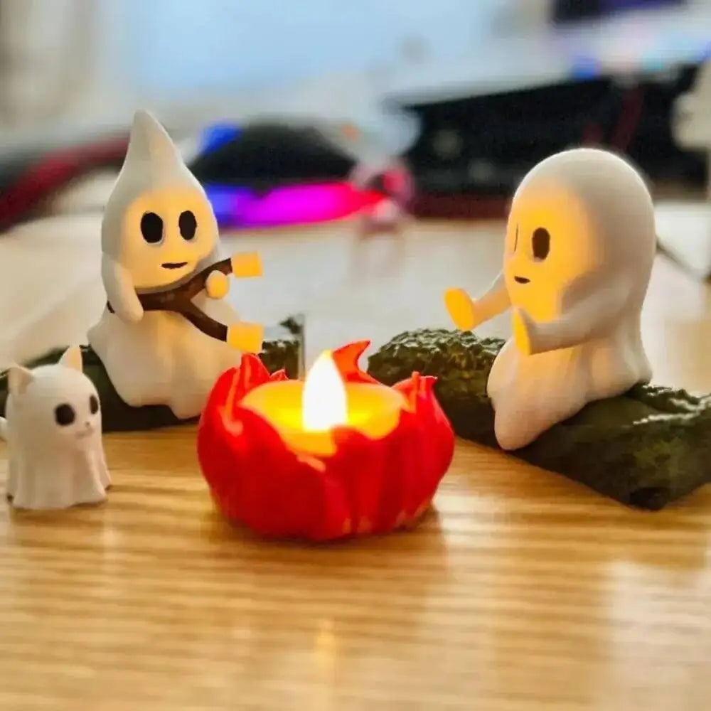 Ghost campfire statue set styled as tabletop Halloween decor